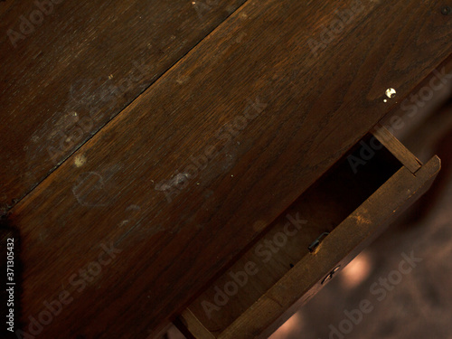 Retro table top view. Antique brown wooden table with a drawer. Copy space. Layout