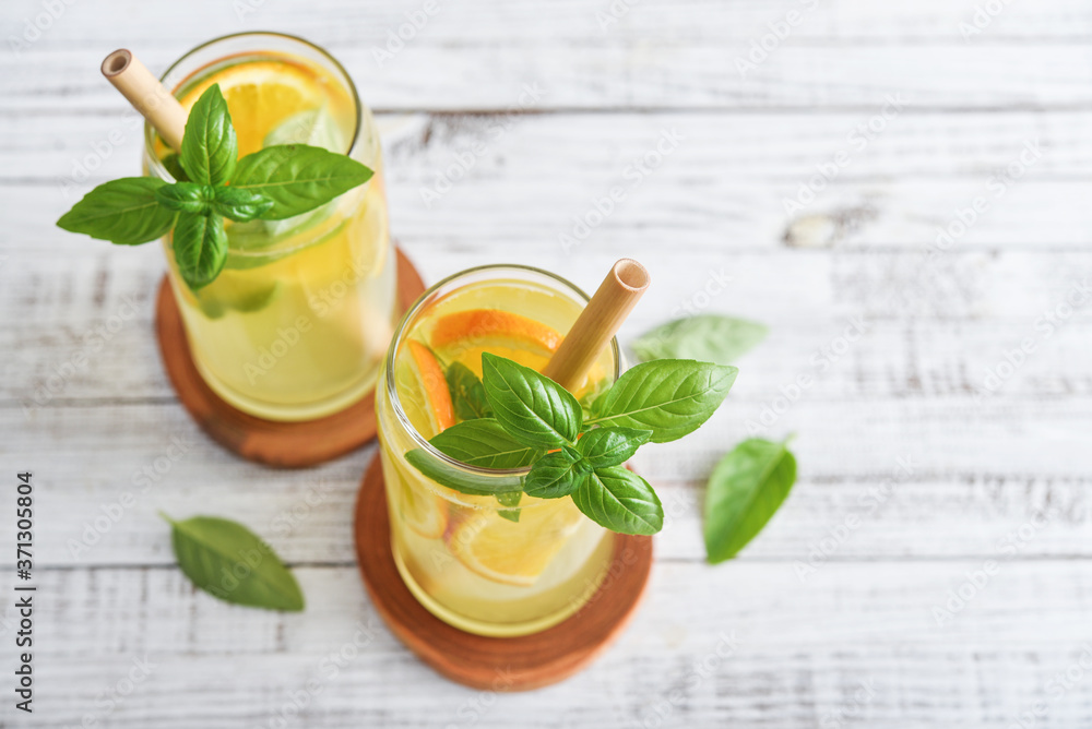 Fototapeta premium Lemonade with orange and basil