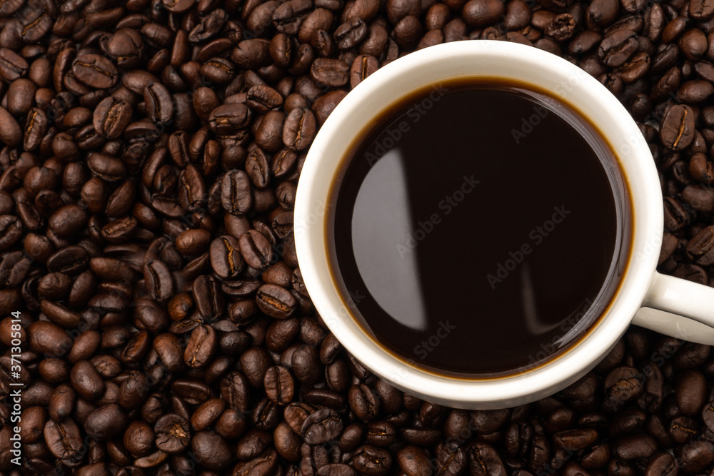 Cup of coffee with coffee beans background Cup of coffee with coffee beans background