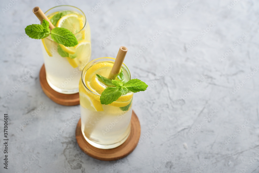 Fototapeta premium Lemonade with lemon and basil