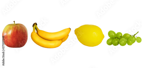 Fruits (apple, lemon, banana, grapes) on a white background, isolated