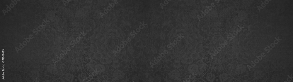 Old dark black anthracite vintage shabby patchwork flower motif tiles stone concrete cement wall texture background banner