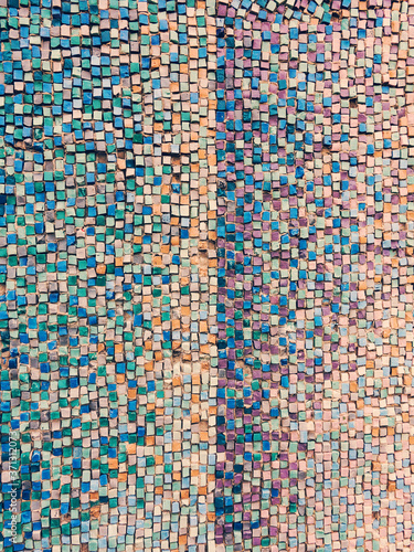 Detail of beautiful old collapsing abstract ceramic mosaic adorned building. Venetian mosaic as decorative background. Selective focus. Abstract Pattern. Abstract mosaic colored ceramic stones