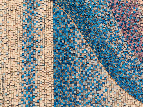 Detail of beautiful old collapsing abstract ceramic mosaic adorned building. Venetian mosaic as decorative background. Selective focus. Abstract Pattern. Abstract mosaic colored ceramic stones