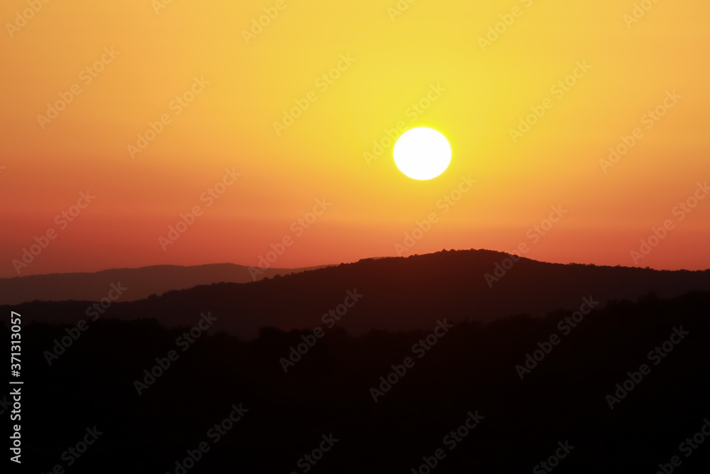 Sunset on the hills of the Tuscan Maremma, Italy.