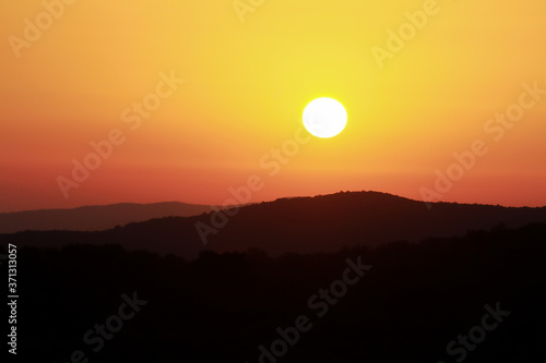 Sunset on the hills of the Tuscan Maremma  Italy.