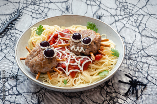 Cutlet look like a spider with spaghetti pasta photo