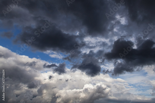 Epic Storm sky, dark grey and white rain clouds background texture
