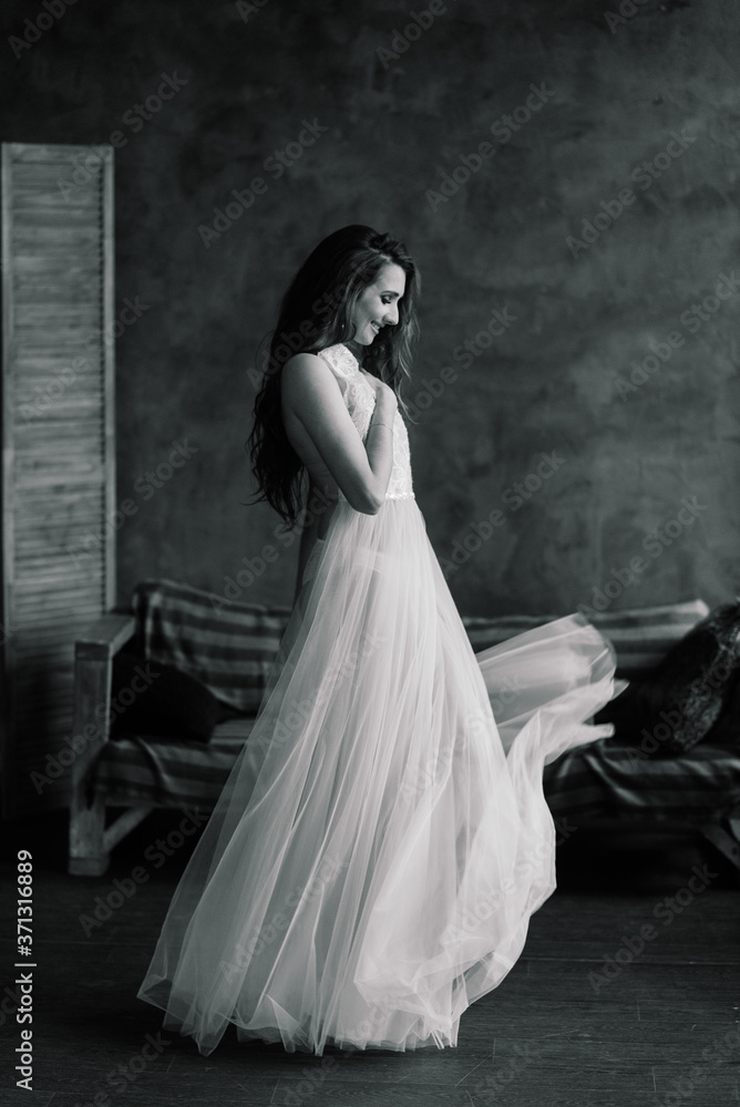 Morning of the bride. Sexy girl posing in white lace underwear. Portrait of a beautiful young female in a white underwear. Seductive woman in white linen and a peignoir. Morning of the bride. Sexy girl posing in white lace underwear. Portrait of a beautiful young female in a white underwear. Seductive woman in white linen and a peignoir.