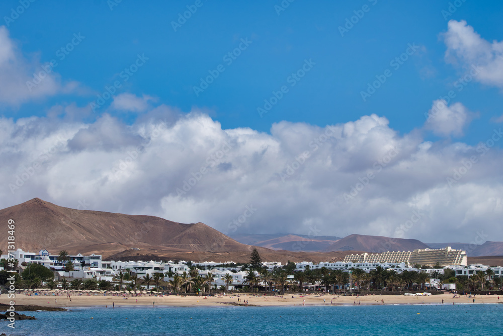 View of the beach in Costa Teguise on Lanzarote Island, Spain View of the beach in Costa Teguise on Lanzarote Island, Spain