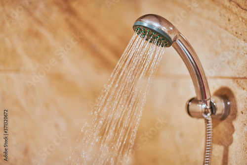 Фотография Showerhead in bathroom.