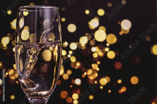 two glasses of champagne on a black background