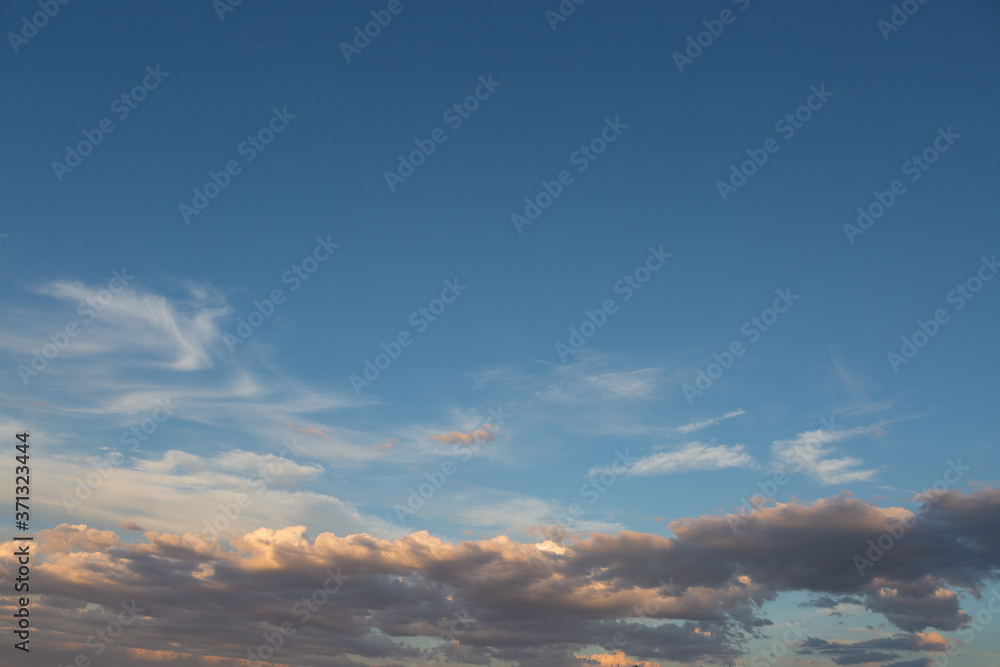 Fototapeta premium Beautiful atmospheric dramatic clouds in the evening at sunset.