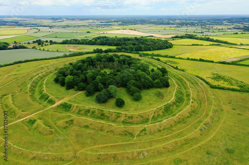 Aerial view of Badbury Rings in Dorset, United Kingdom. A historic Iron Age hill fort in east Dorset, England, which dates from around 800 BC and was in use until the Roman occupation of 43AD. photo