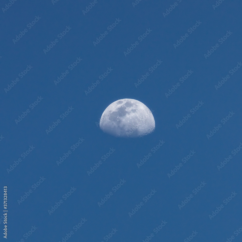 View on the Half-moon in the blue sky