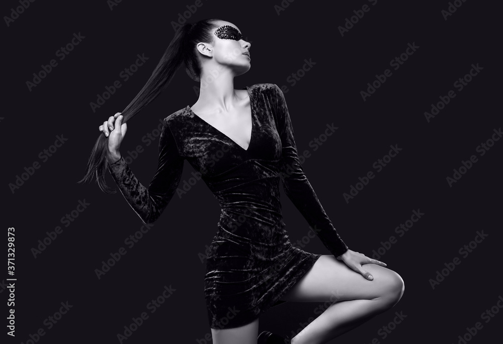 Charming elegant brunette woman in beautiful purple dress and sequins mask Charming elegant brunette woman in beautiful purple dress and sequins mask