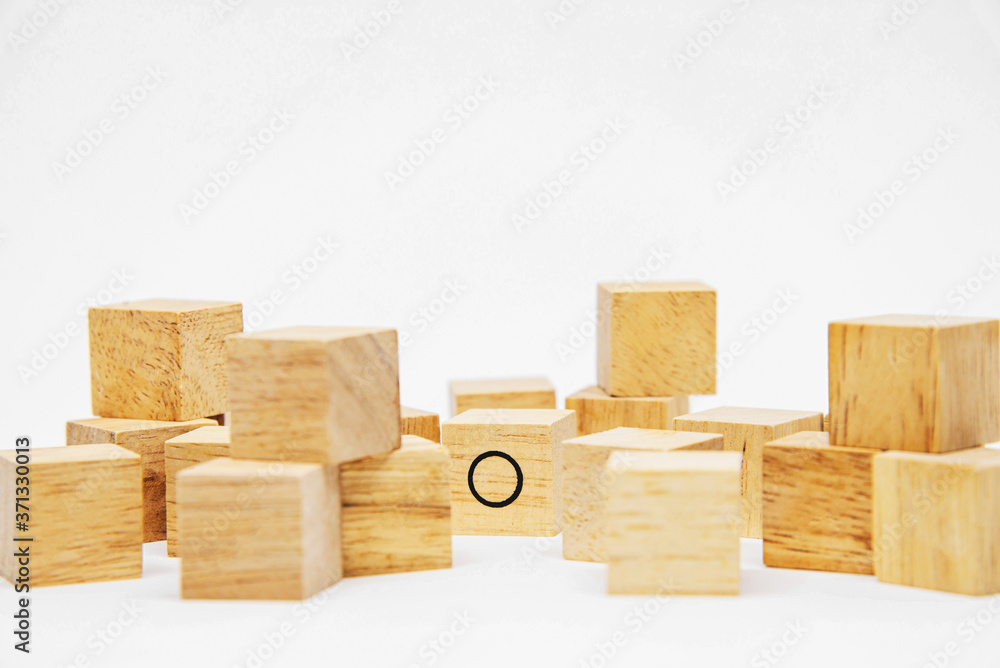 One O wooden block in the group of X wooden block on white background for idea concept design One O wooden block in the group of X wooden block on white background for idea concept design