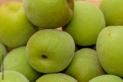 Harvested Green Japanese apricot fruit, Young fruits of Ume