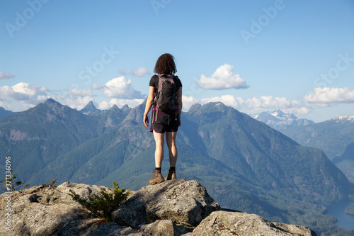 Adventurous Girl Hiking on top of Tin Hat Mountain  part of the popular Sunshine Coast Hiking Trail in Powell River  British Columbia  Canada. Concept  Explore  Adventure  Travel