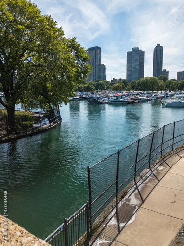 Diversey Harbor mouth underpass for boats in Chicago, Illinois with highrises in background photo