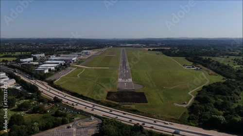 Airport Runway aerial drone shot. UK flights, transportation. COVID-19 means lack of flights, quiet. Flybe job losses. M27 Motorway. Zoom shot photo