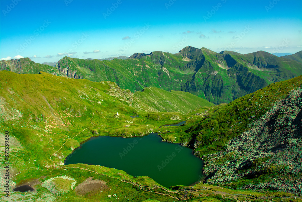 a beautiful landscape with Lake Capra in the Fagaras Mountains