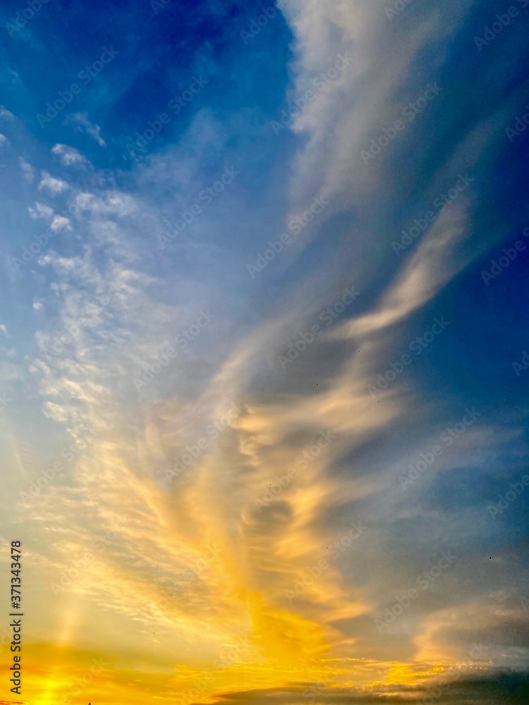 Blue sky with white clouds at sunset in summer time.Free space. Blue sky with white clouds at sunset in summer time.Free space.
