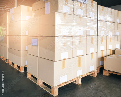 Package boxes, Cargo export, Shipment. Stack of cardboard boxes or shipment goods for delivering to a customer.