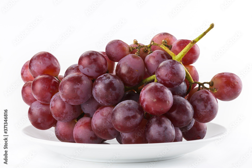 Ripe red grape isolated on white background.