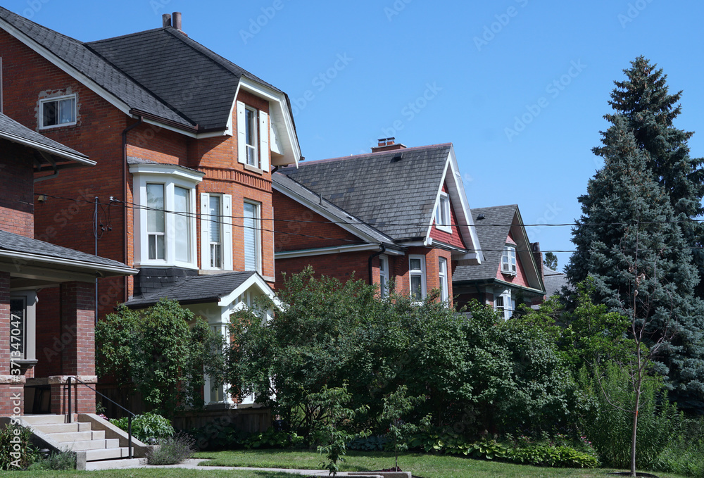 Street of modest middle class homes with front yards