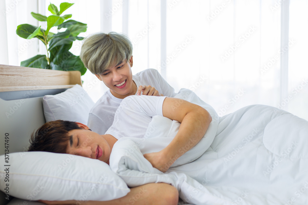 Homosexual men or gay couples lying on the bed. Homosexual men or gay couples lying on the bed.