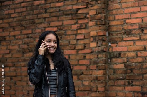 happy woman making a call with her cell phone