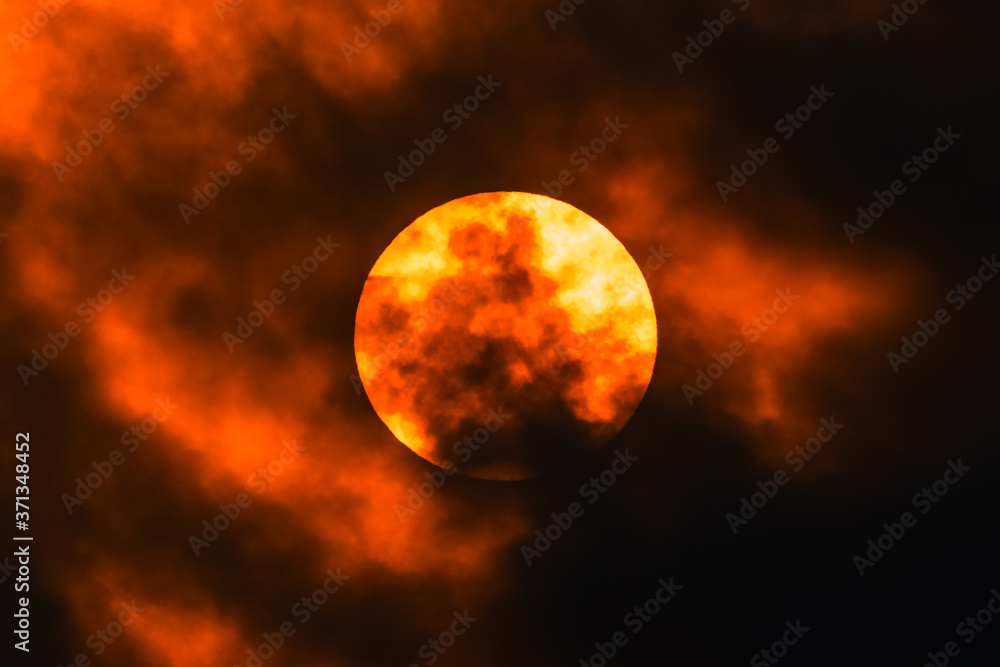 Sun in the clouds, dramatic sunset Sun in the clouds, dramatic sunset