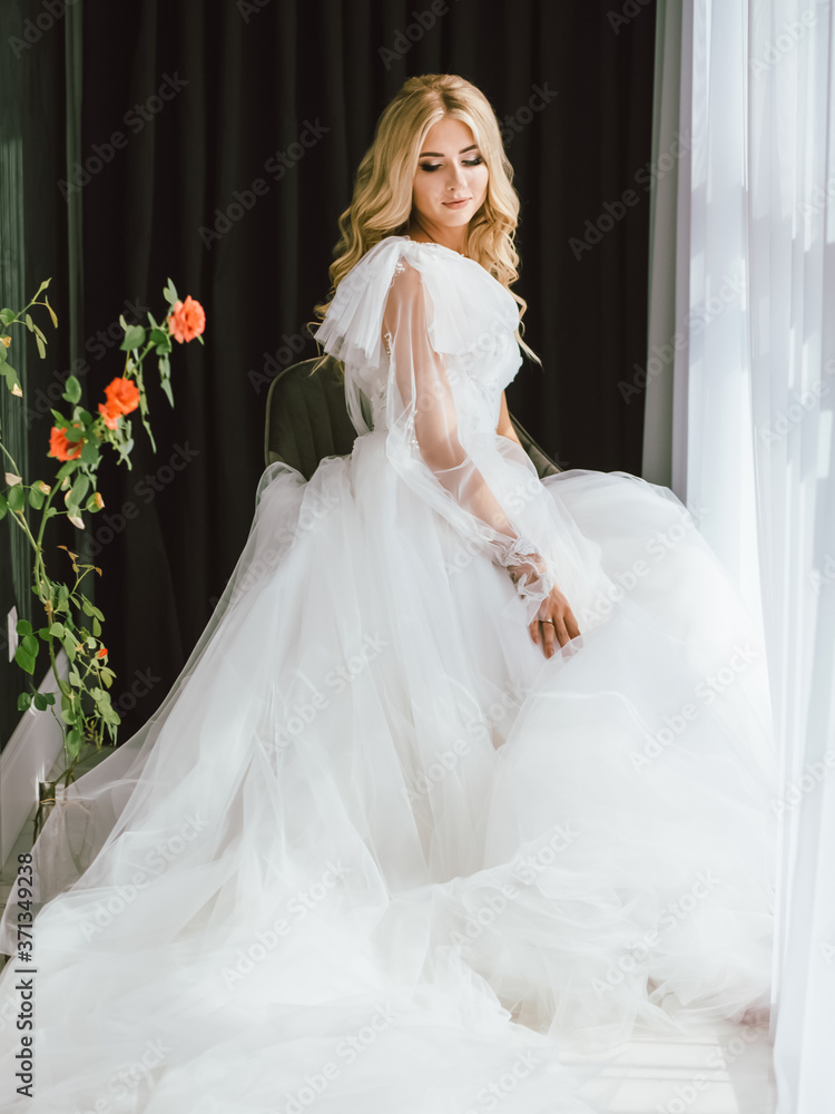 bride in a wedding dress is preparing for the holiday, romantic photo