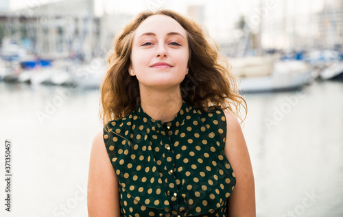 Close up of young attractive woman tourist at quay with sailboats on background in Barcelona Free Download Close up of young attractive woman tourist at quay with sailboats on background in Barcelona - GFXLoad