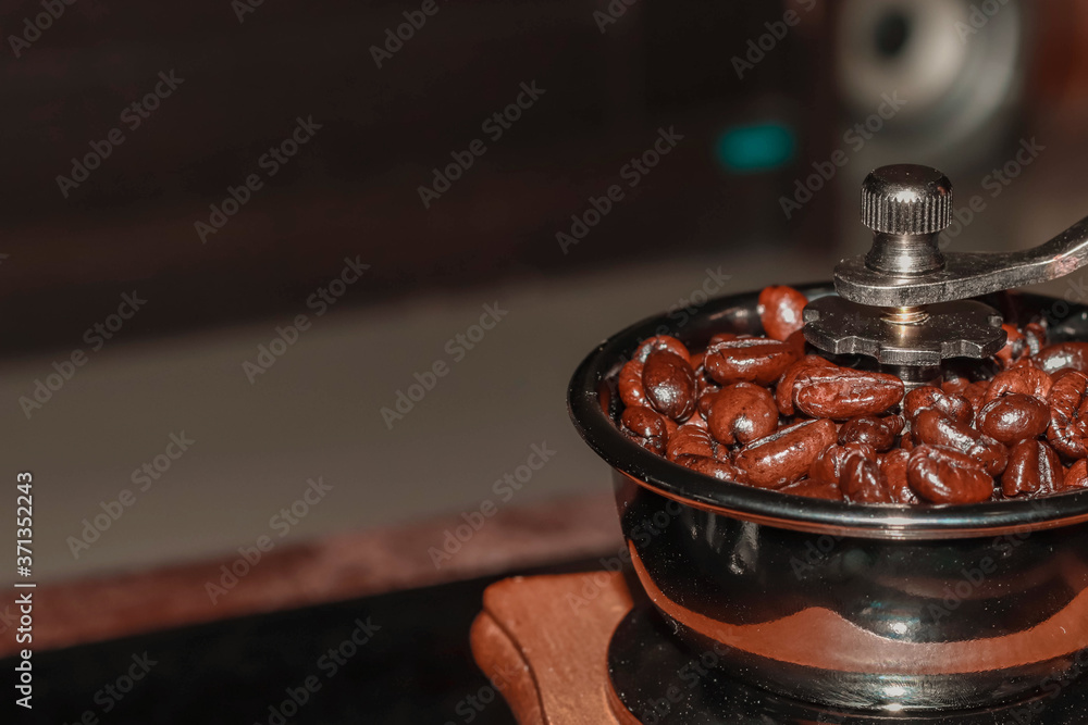 Close up coffee beans in coffee grinder Close up coffee beans in coffee grinder