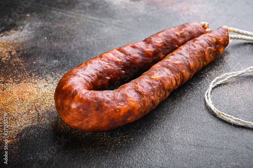Traditional chorizo salami sausage on old metall background