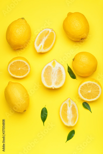 Fresh lemons on color background
