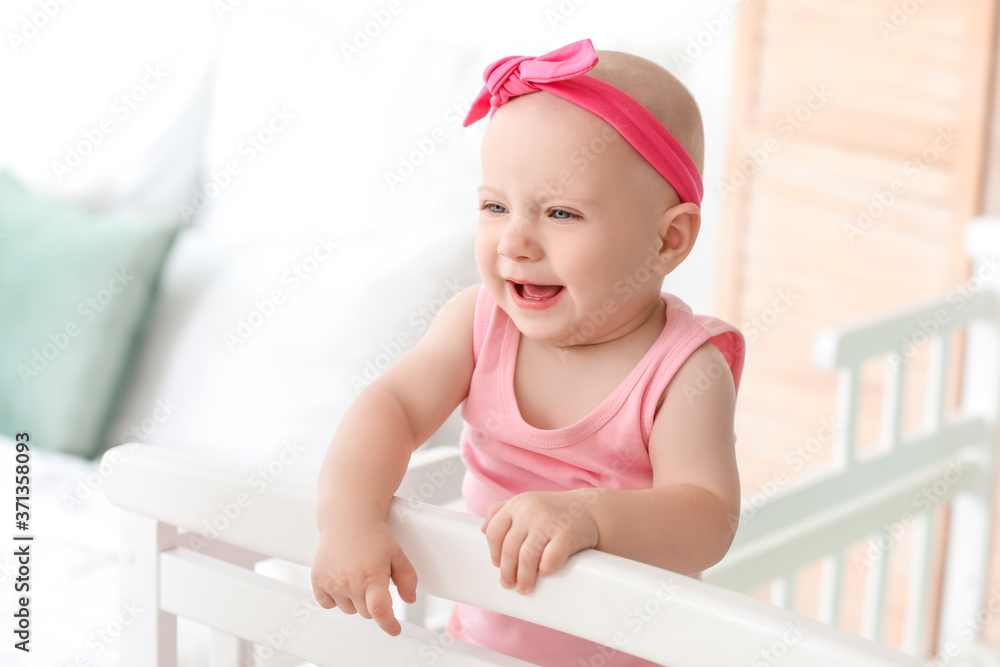 Cute little baby in bed at home Cute little baby in bed at home