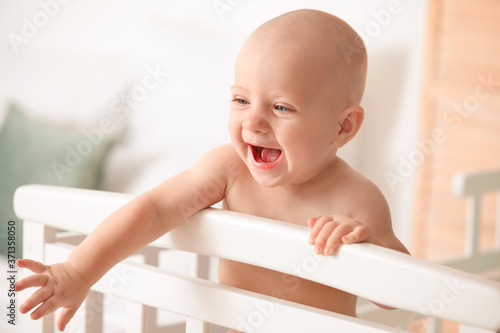 Cute little baby in bed at ...