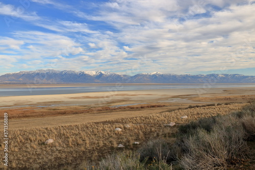 Landscape at Antelope Island surrounded by snowcapped mountains, Utah