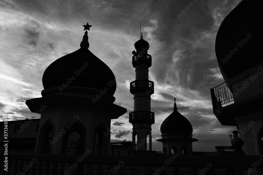 Silhouette of mosque at sunset