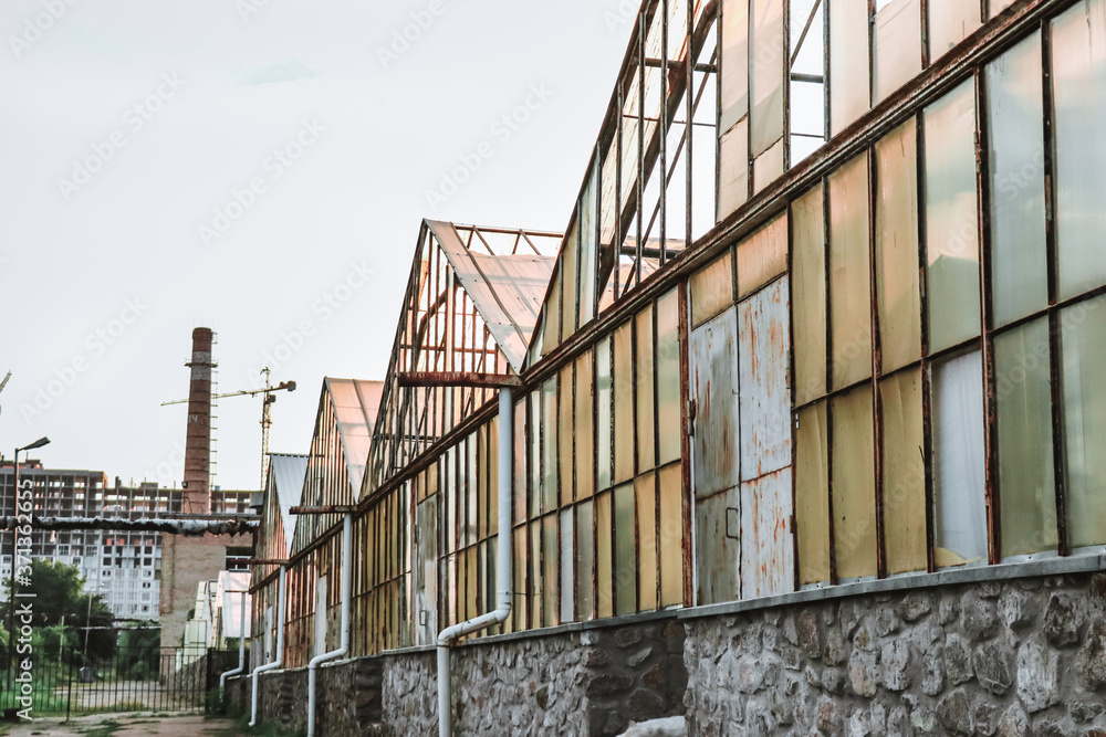 Old rusty greenhouses in the industrial area Old rusty greenhouses in the industrial area