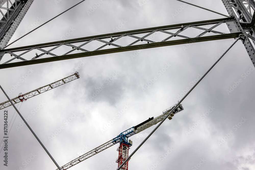 Tower cranes working at building construction industry
