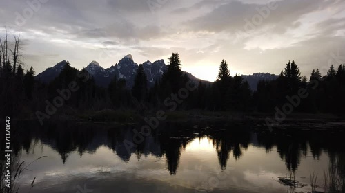 Water reflection during sunset at Grand Tetons National Park photo