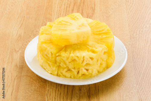 Sliced of pineapple on white dish
