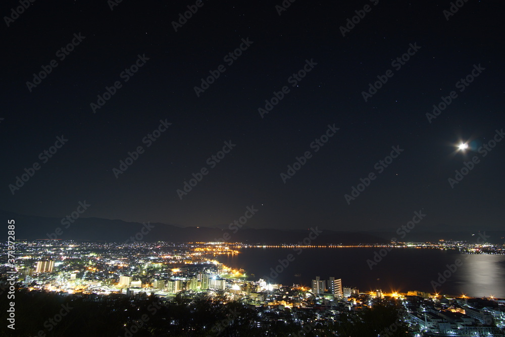 Night view of the city of Suwa lake in Nagano, Japan