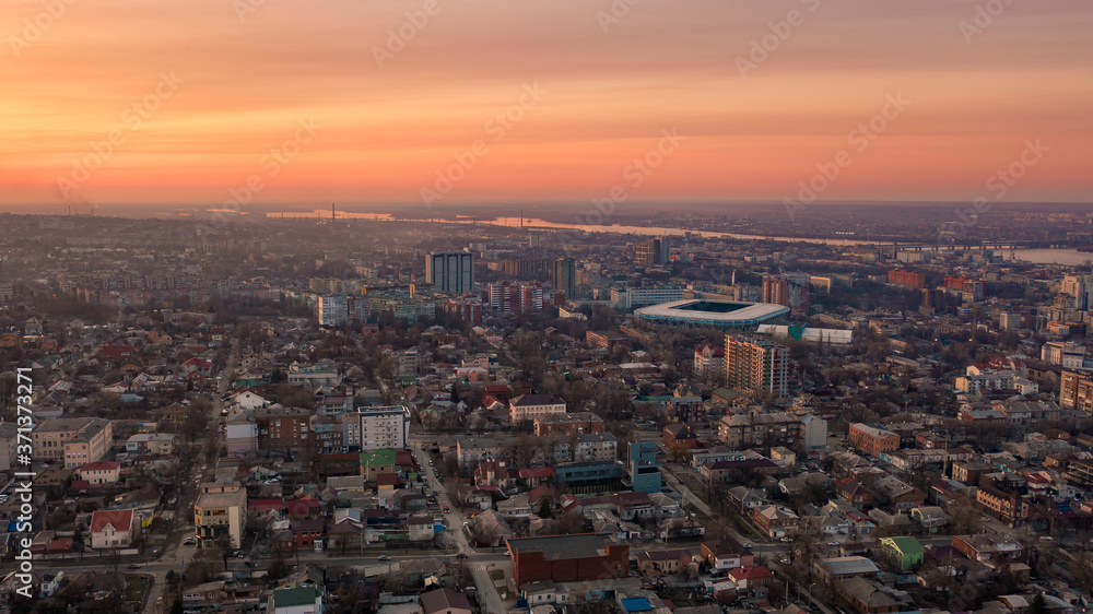 Aerial top view of the cityscape in Dnipro midtown at sunset. Bird's eye view from the drone of buildings and skyline in the modern city. (Dnepr, Dnepropetrovsk, Dnipropetrovsk). Ukraine