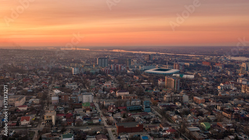 Aerial top view of the cityscape in Dnipro midtown at sunset. Bird's eye view from the drone of buildings and skyline in the modern city. (Dnepr, Dnepropetrovsk, Dnipropetrovsk). Ukraine