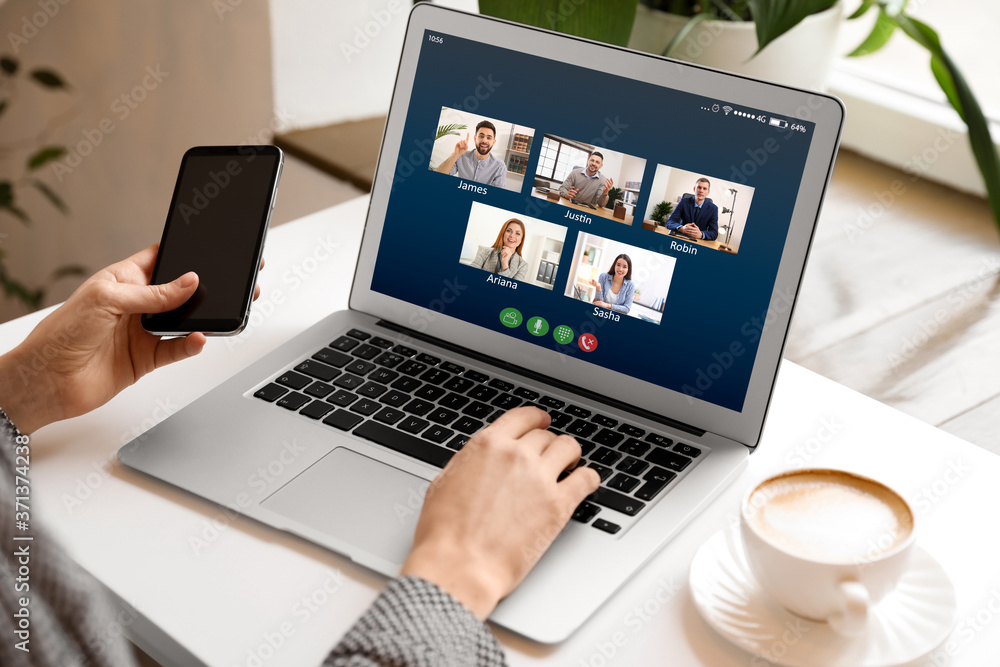 Woman having online meeting with her team via laptop, closeup Woman having online meeting with her team via laptop, closeup